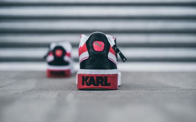 Close-up of comfortable sports shoes on a wooden floor.