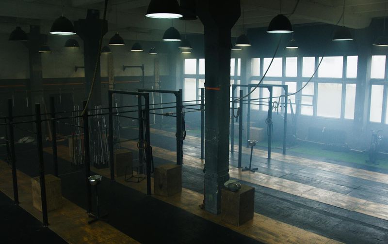 Spacious minimalist room with a yoga mat on the floor.